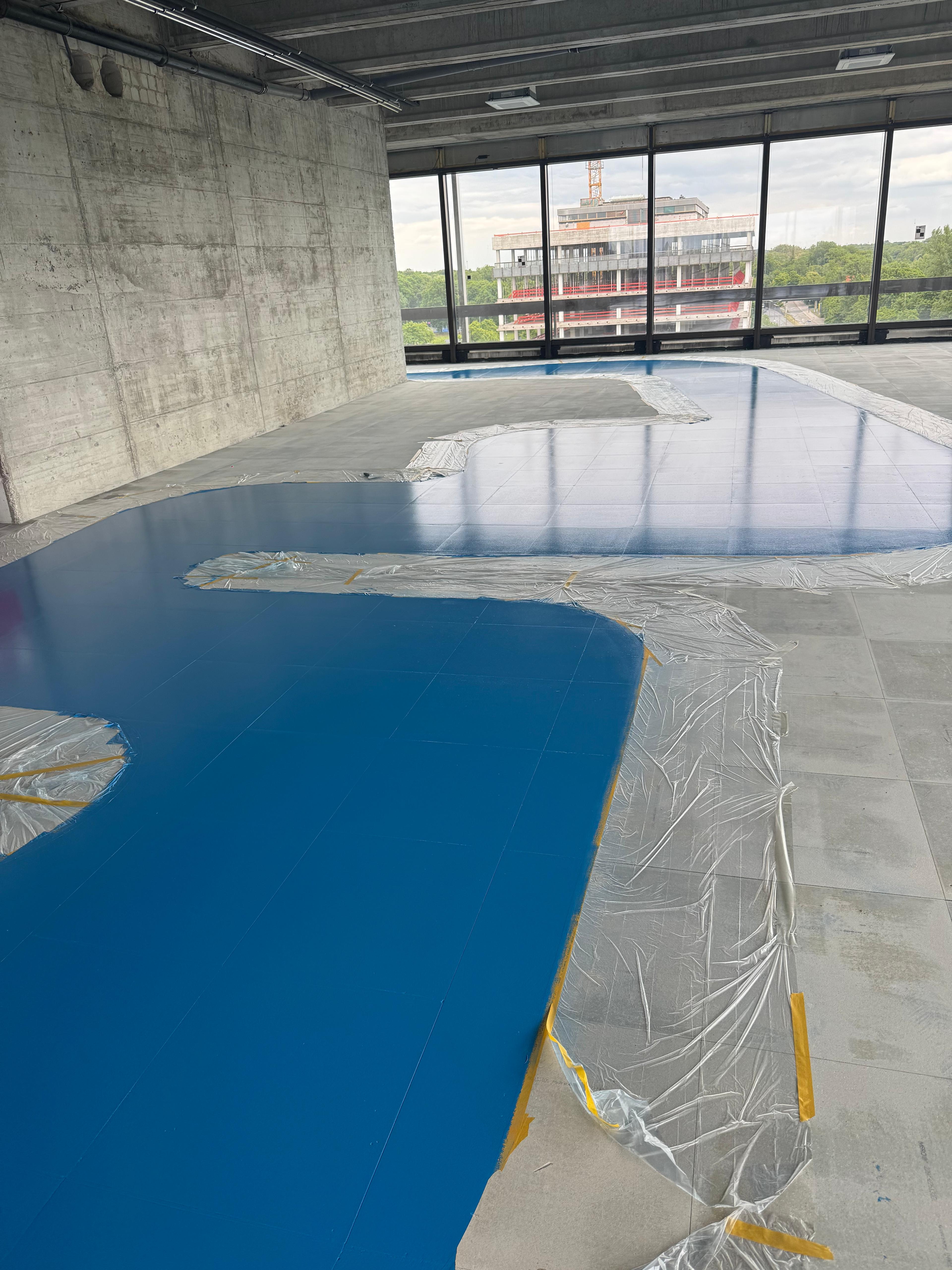 Bodenbeschichtung Tucherpark München mit Stadtblick